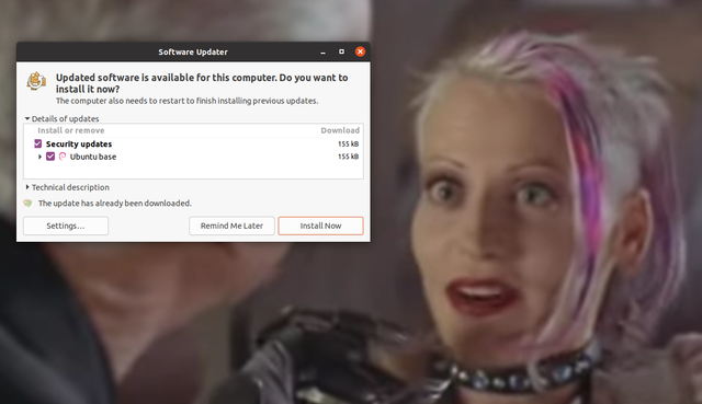 Screenshot of Ubuntu's update manager popping up during the movie "Tank Girl."